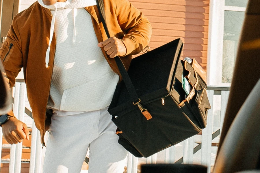 dad carrying organizer with shoulder strap